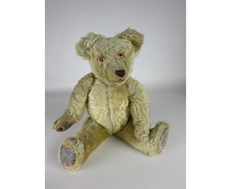 A gold fully jointed Teddy Bear with button in ear and original pads, probably Chad Valley, Childhood companion of Betty Hugh