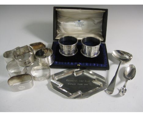 A pair of George V silver Napkin Rings, Birmingham 1915, in case, seven various Napkin Rings, Ashtray, Feeding Spoon and Ladl