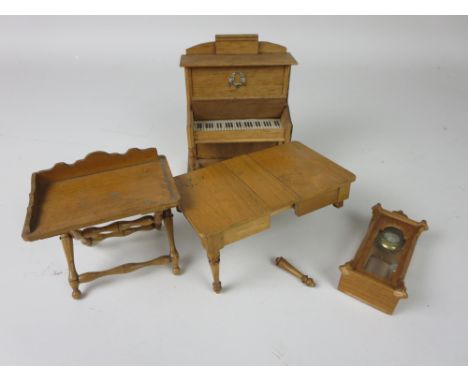 A German made dolls house Piano, 6in H, a butlers tray, hanging wall clock and an extending dining table A/F.