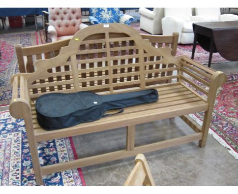 A modern teak Garden Bench with shaped back on square cut supports, 5ft 6in W