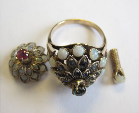 An Opal metamorphic Ring with interchangeable clusters, one claw-set central red stone, the other cluster set blue stones