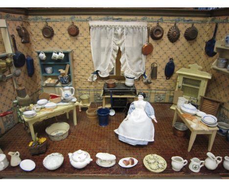 An impressive large German made Doll's Kitchen with original papers. Tinplate meth fired cooker, wall shelves, mincer and a l