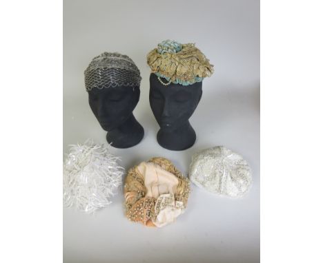 A 1920's bugle beaded Cap, turquoise green decorated bonnet, pearl decorated hat, 70's white cap and a sequinned cap (5)