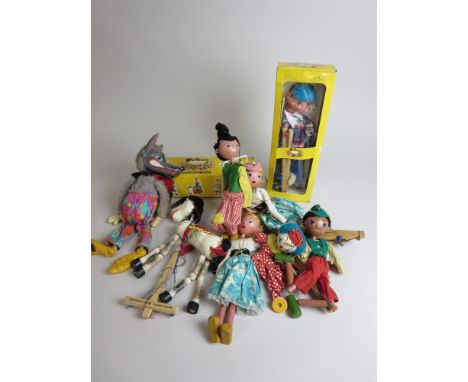 A Pelham Puppet Horse (with instructions) and Boy, both yellow boxes, and a clown and four others (unboxed) with a larger wol