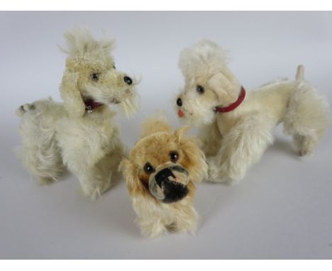 A cream mohair Poodle, Steiff Pekinese and a Poodle. Poodle height 5 1/2in. Suitable for doll's accessories