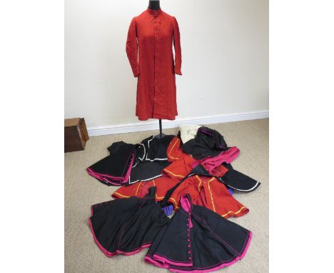 A large box containing a wide assortment of Catholic Church Dress including capes, one fur lined, two academic hoods, a red c