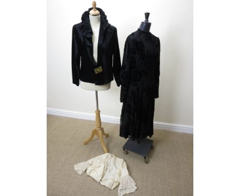 A black silk velvet Jacket with an amber coloured feature clasp and ruched collar, 1920's, and a black devor full length dres