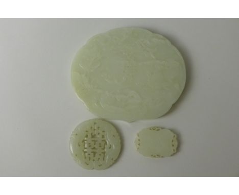 Three Chinese celadon jade Carvings including a shaped rectangular Pendant carved with Shou character reversed with a bird on