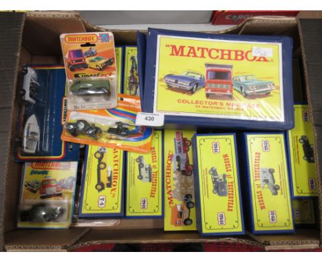 Fourteen boxed Matchbox reproduction Y and M Series Vehicles, a Matchbox Collector's Mini Case with vehicles, Dinky promotion