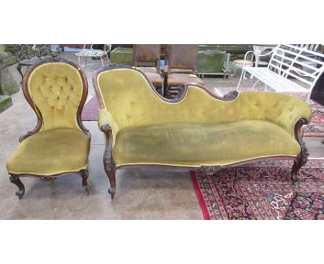 A Victorian walnut framed Chaise Longue with carved rose decoration and button back green upholstery, and a matching button b