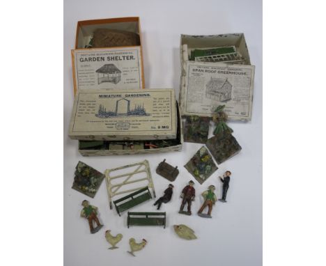 A boxed Britains No.28 Garden Shelter, a boxed No.53 Span Roof Greenhouse, a No.9 box containing various trees, shrubs, borde