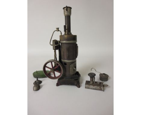 A vertical Steam Engine stamped Made in Bavaria G.B. 1886, with various accessories, 11 1/2in H