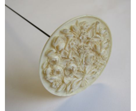 A Dieppe carved ivory Hat Pin the large finial depicting bouquet of flowers