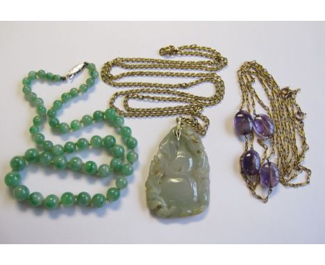A single row graduated Jade Bead Necklace on white metal clasp, stamped 9ct, a carved and pierced Jade Pendant on chain, stam