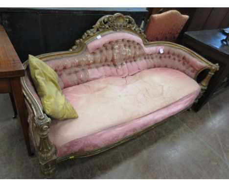 A 19th Century giltwood Settee with raised scroll and shell carved back, button upholstery on turned tapering front supports 