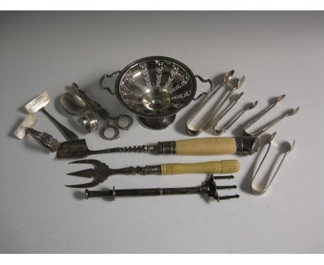 A pierced silver pedestal Dish, Birmingham 1949, four pairs of Sugar Tongs, pair of Nips, plated Stilton Scoop, Bread Fork an