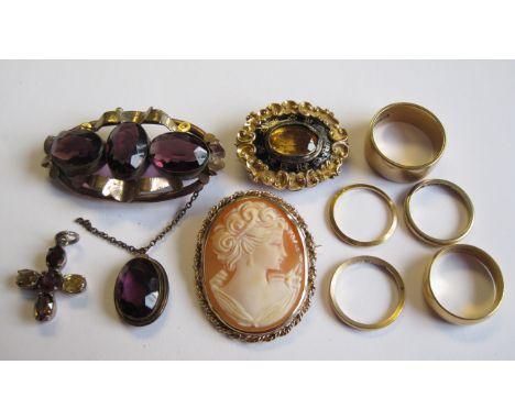 A carved shell Cameo Brooch, a Citrine and Enamel Mourning Brooch, a Pendant Cross, a Brooch set purple stones, three 9ct gol
