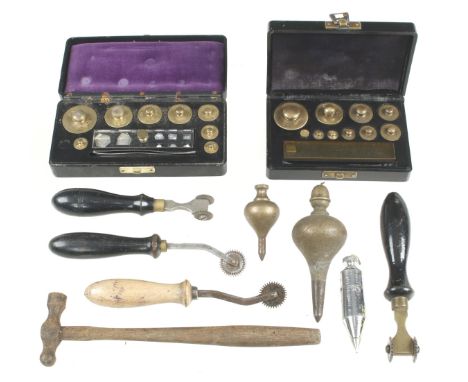 Three plumb bobs, two part sets of weights and four leatherworker's tools G 