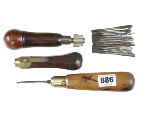 A rosewood handled compendium tool with 12 tools and two button pad tool handles G+ 