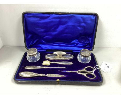 A Hallmarked Silver Mounted Manicure Set, L&amp;S, Birmingham 1912, comprising nail buffer, toothbrush, scissors, cuticle too