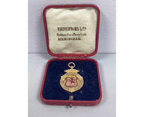 A 9ct Gold Medallion Fob, "SCOTTISH JUVENILE F'BALL ASSOCN", with enamel dragon shield centre, engraved to reverse, "FINALIST