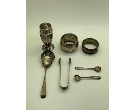 An Assortment of Hallmarked Silver Items, to include a pair of Victorian sugar tongs, Victorian salt spoon, pepper pot, napki