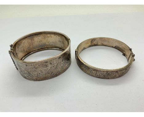A Hallmarked Silver Wide Hinged Bangle, W&amp;Co, Birmingham 1946, of allover scrolling foliage design, to push clasp and saf