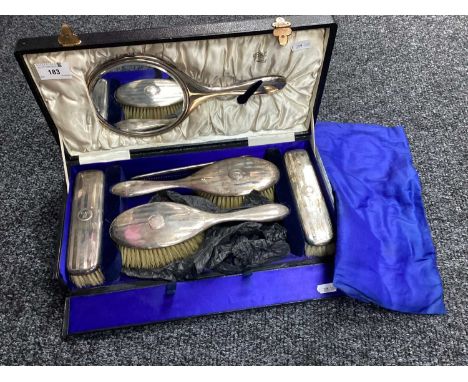 A Hallmarked Silver Mounted Five Piece Dressing Table Set, of engine turned design, initialled "M", within fitted case.