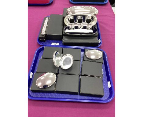 A Collection of Modern Compact Mirrors, of plain oval form; Together With Four Plated Fountain Pen and Inkwell Sets, of plain