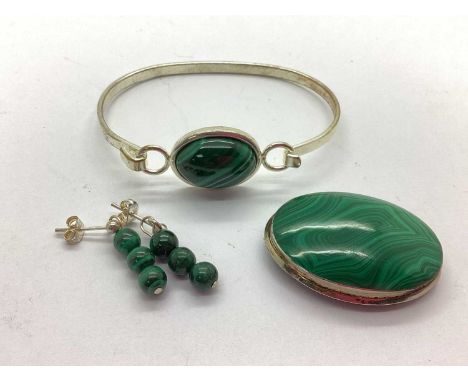 A Malachite Inset Oval Panel Brooch, of minimalist design, together with a hardstone inlaid bangle, and a pair of hardstone d