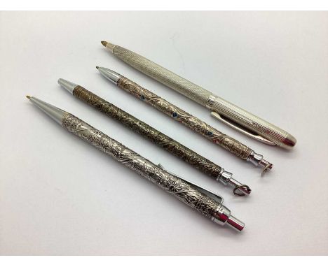 A Hallmarked Silver Pen, Birmingham 1957, allover engine turned (internal spring mechanism faulty); three further pens, inclu