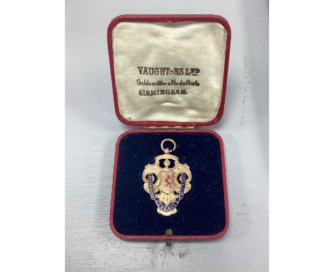A 9ct Gold Medallion Fob, "LANARKSHIRE JUVENILLE F'BALL ASSOCN", with enamel shield centre, engraved to reverse, "FINALISTS" 