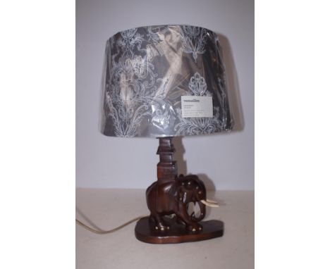 Carved wooden lamp base with a new lamp shade 