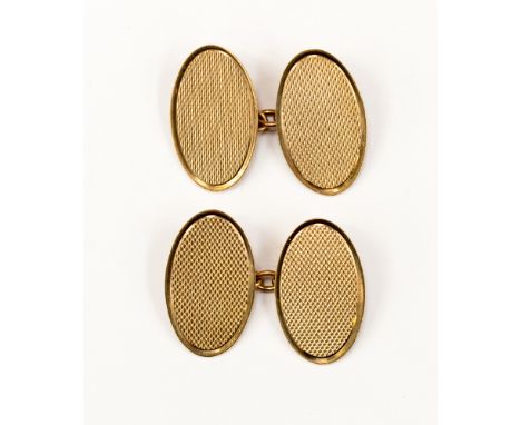 A pair of 9ct. gold cufflinks approx 5.3gms, engine turned decoration no initial engraved original box