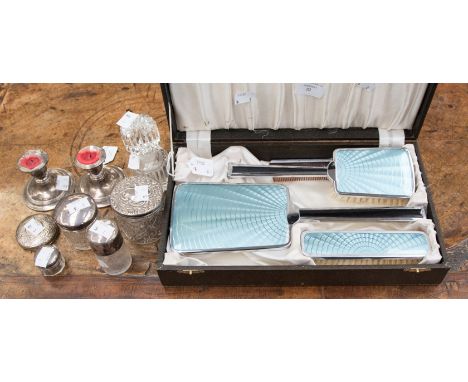 Four glass and cut glass dressing table pots with silver tops, a cut glass perfume bottle, with a cased brush and comb set ha