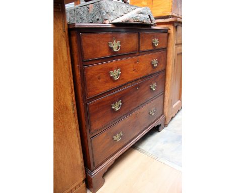 A George III mahogany chest of drawers, comprising two short over three long graduated drawers, raised on bracket feet