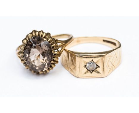 A 9ct gold smokey quartz dress ring size Q, a large Czechoslovakian set dress ring (9ct. gold) size U with a combined total g