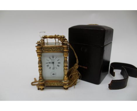 Rapport of London gilt brass French carriage clock in leather case, small proportions 