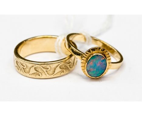 One 14ct.gold opal ring, one 9ct gold patterned ring