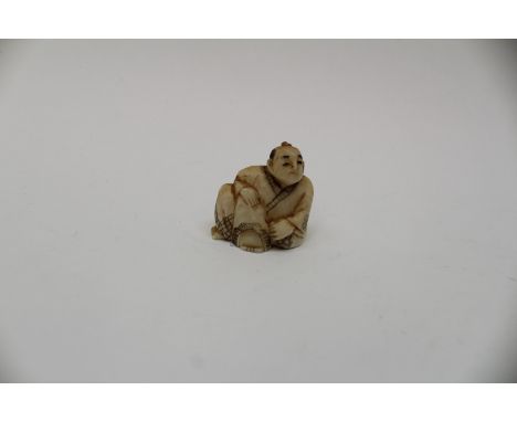Japanesse Netsuke of a seated male, signed to base 