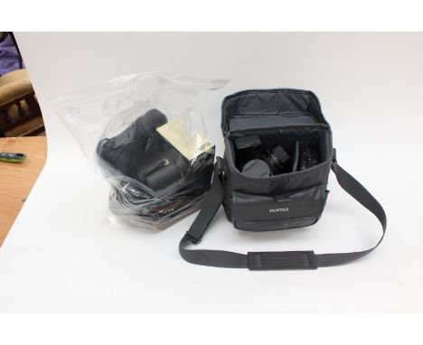 A collection of various cameras, comprising Pentax MZ-50, with two Pentax lenses, plus Vivitar lense, a Rollei camera, a flas