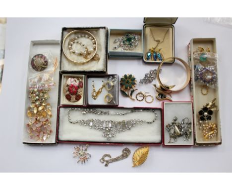 A Monet bangle, a collection of vintage brooches, paste necklace, screw earrings etc