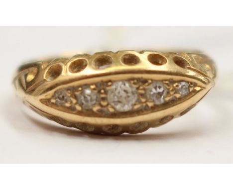 An 18ct gold boat ring set with five (tested) diamonds. Ring total gross weight 3gms, size K. 