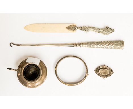 A silver bangle brooch, inkwell with a button hook filled silver handle, ivory blade letter opener with filled silver handle 