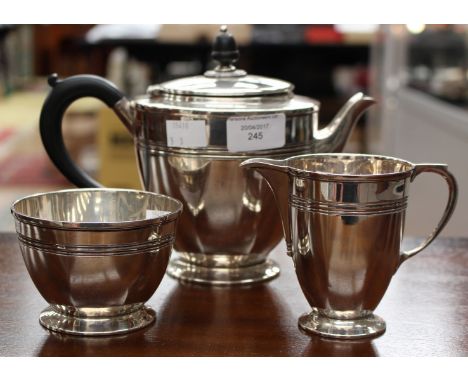 A silver three-piece tea set, in Art Deco style, comprising teapot, milk jug and sugar basin, Sheffield, 1940, maker Roberts 