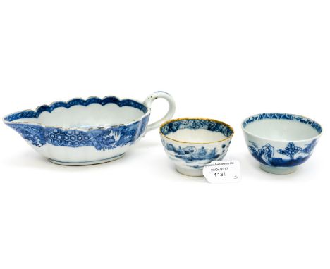 A Chinese export blue and white sauce boat, scalloped edge and underglaze landscape, together with two tea bowls, one in the 