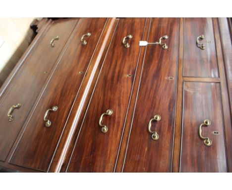  A George III mahogany chest on chest, the upper section with a plain dentil moulded cornice, having two short over two long 