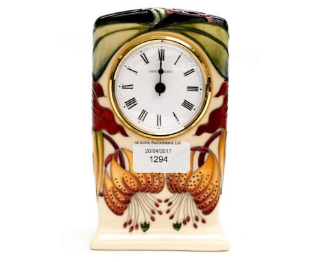 A Moorcroft mantle clock, in the Anna Lilly pattern, designed by Nicola Slaney 