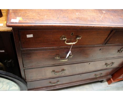A George III mahogany chest of drawers, comprising two short over three long drawers, raised on bracket feet