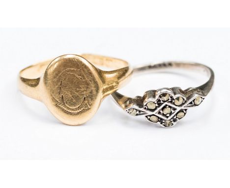 An 18ct yellow gold oval shape signet ring (af) with engraved C, ring size P,  together with a silver marcasite cluster ring 